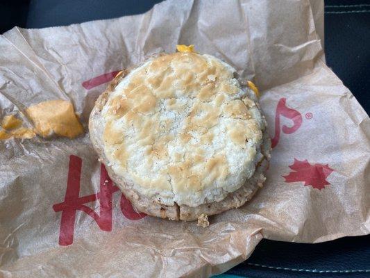 Biscuit and sausage breakfast sandwich.