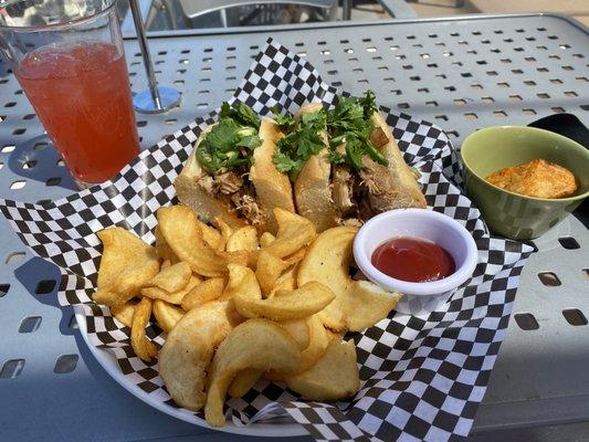 Buffalo Chicken Sandwich with potato wedges.