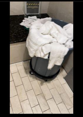 Shower area in the mens room. This is an upgrade since members used to to just pile the towels on the floor until they gave us a bin.