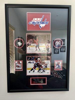 Marcus Johansson custom framing -- two autographed photos; two autographed pucks; two autographed cards; custom name plate; and team logo.