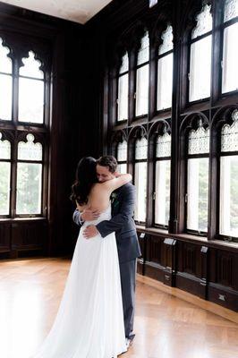 A warm hug during their first look as a married couple during wedding.