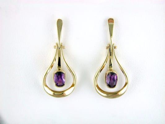 A beautiful amethyst and yellow gold earring set from designer Tom Kruskal