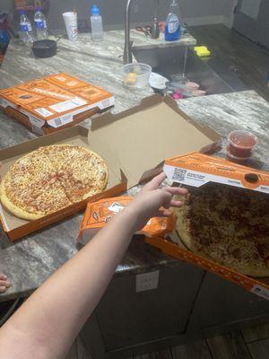 Sausage pizza, cheese pizza, pepperoni and sausage pizza, crazy bread, and marinara.