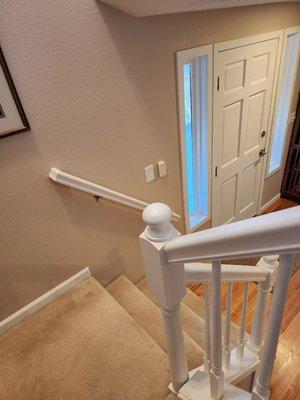 Front door and stair railing look new after a fresh coat of paint