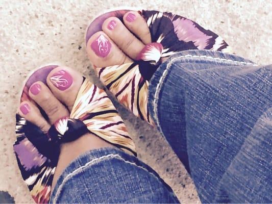 I have pretty toes enhanced with purple shellac and designs. }:{