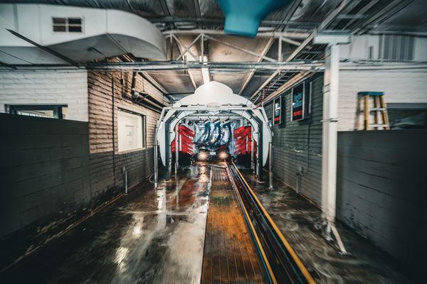 A view of our state of the art full service wash tunnel .