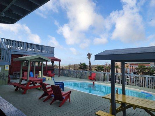 Pool area. Loved the Adirondack chairs.