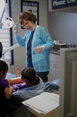 Dr. Barragan screening kids at our Give Kids a Smile event