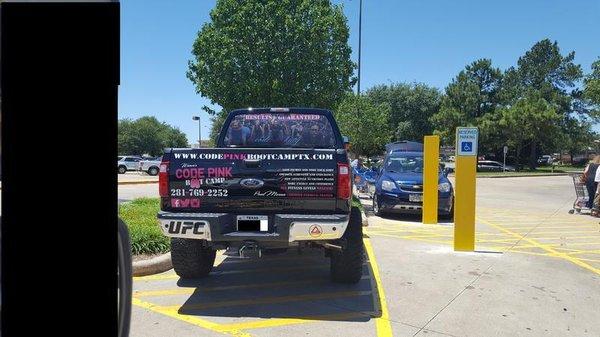 Some fitness company, parks in Handicapped loading area to save a few steps.