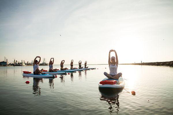 SUP (Stand Up Paddleboard) Yoga, Pilates and fitness classes on the water