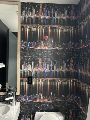 The NYC lights wallpaper inside the bathroom and elevators.