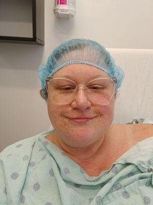 Me in my surgery gown and hair net, ready for my spinal stimulation device to be implanted.