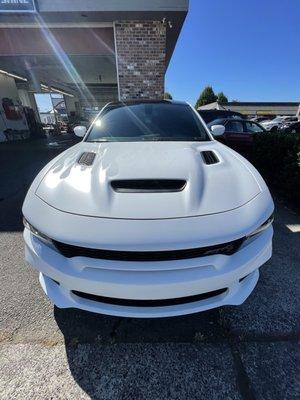 Paint Correction, Ceramic Coating, and Ghost flames Vinyl put on this Hellcat