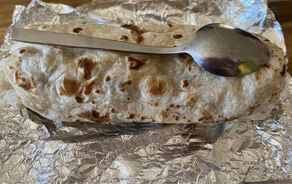 Carne Asada burrito (spoon for size comparison) I could only eat half of it.