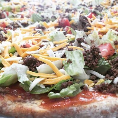 Taco Pizza ~ Whole Wheat Crust, Taco Sauce, Lettuce, Seasoned Ground Beef, Tomatoes & Cheese