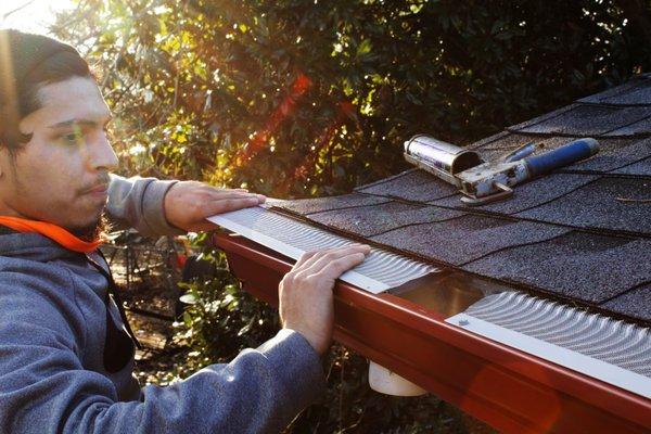 Professional installation of our gutter guard system.