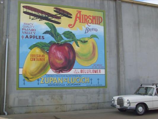 A large mural inspired by a vintage fruit box label