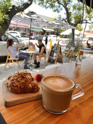 Latte with discounted day-old almond croissant