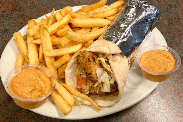 Chicken Pita with French Fries and Spicy Sauce.