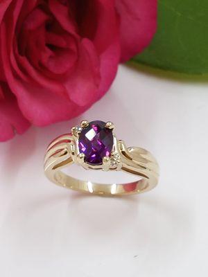 Rhodolite Garnet set in 14k yellow gold ring.