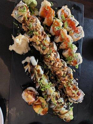 Black Mamba Chef Specialty Roll - bottom  Large Marge Tempura Roll - middle  Crab Rangoon Roll - top