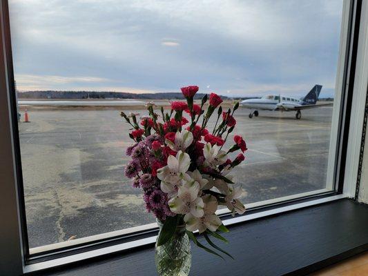 Window seat at the restaurant facing the airport.