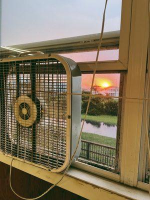 A beautiful sunset seen through one of the back windows of the rink