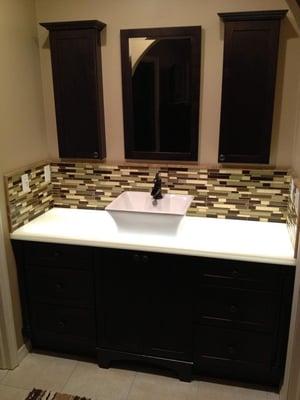 Bathroom vanity and backsplash installed by House Doctors