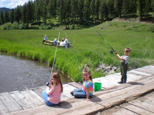 kids fishing off the bridge