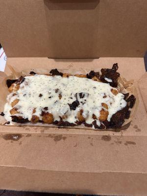 Cheddar Bacon Loaded tots, burned in the oven then drowned in ranch. Where is the quality standard?