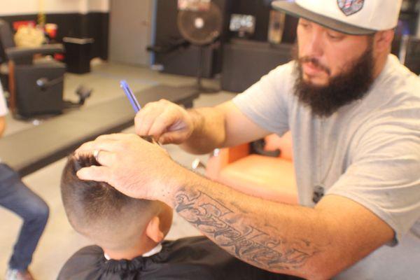 Good haircut at the fade factory on Palm & Hollister.