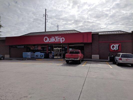 Outside. Convenience store storefront.