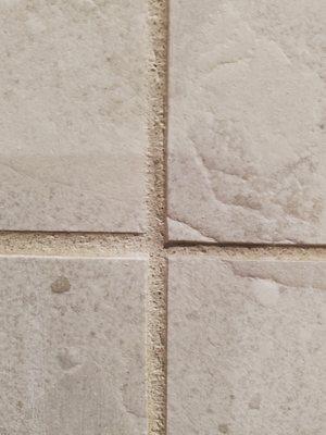 They used different sized spacers causing grout lines to be different sizes.