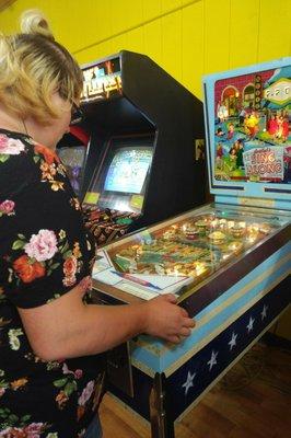 Baby was jamming on the pin ball game!