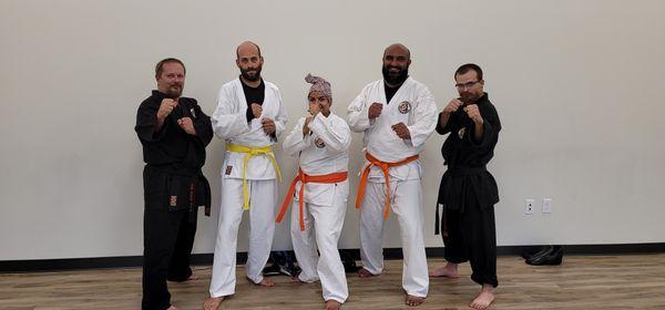 Three of our adults after grading and promotion.