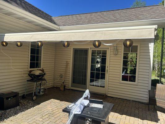 This awning has a front screen that lowers quickly proving full shade.