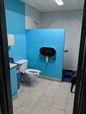 Restroom and shower located in laundry room