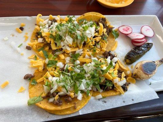 Street tacos with yellow cheese