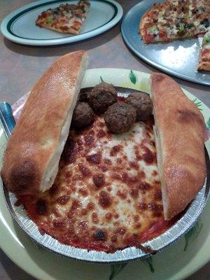 Lasagna with two bread sticks.  I added meatballs but definitely do not need them.