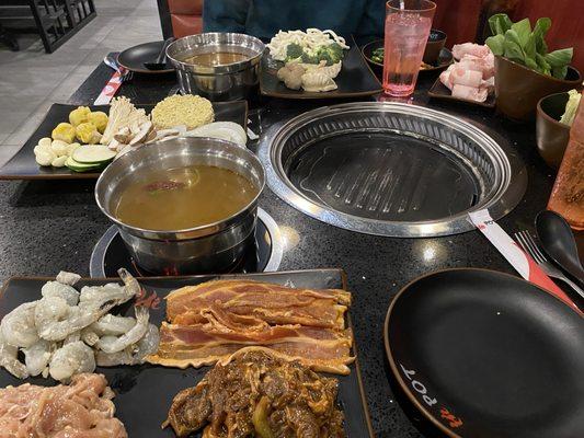 Spicy Szechuan soup base, garlic shrimp and chicken, pork belly, and spicy beef