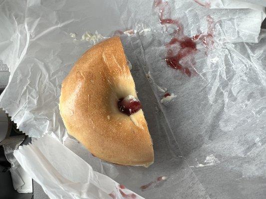 Plain toasted bagel w/ cream cheese & jelly.