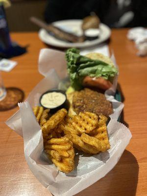 Crab cake sandwich and waffle fries