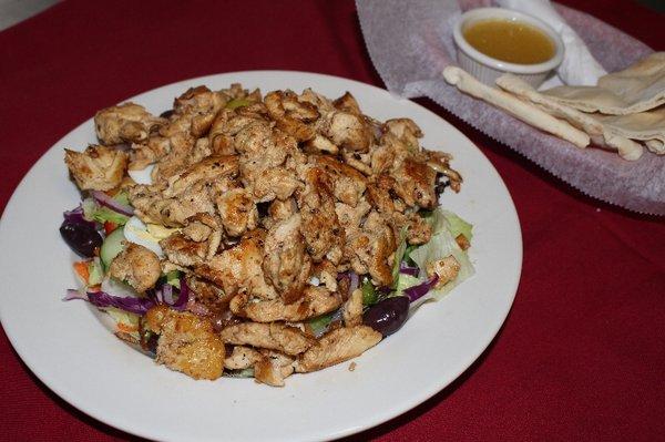 Our grilled chicken salad!Each salad comes with a side of dressing and Syrian bread.