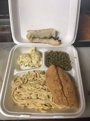 Catfish and macaroni and cheese, green peas with potato salad and toast