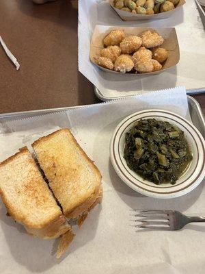 Chopped pork sandwich with collard greens and corn bites.