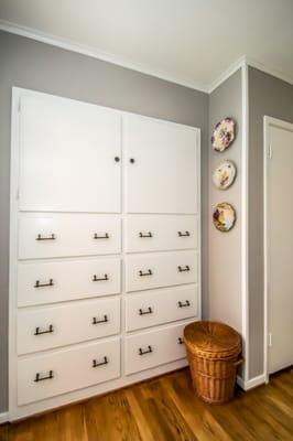 Contrasting the trim and cabinetry in white highlighting the beautiful vintage handiwork in this classic older home.