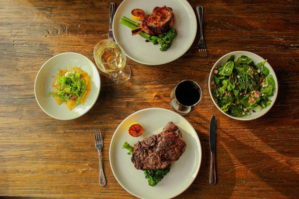 WILD MUSHROOM RAVIOLI, POACHED PEAR SALAD, VEAL CHOP, COWBOY RIBEYE