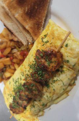 Blackened Catfish Omelet topped with shrimp and breakfast potatoes #ChefMikeB