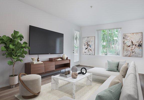 Modern living room with staged furniture and hardwood-style flooring.