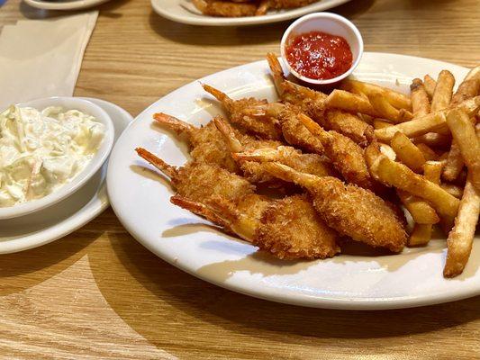 Breaded Shrimp Dinner of 12 jumbo breaded shrimp with cocktail sauce, coleslaw and fries.